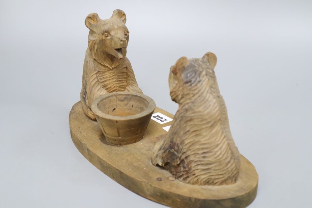 A carved wood desk tidy, width 30cm